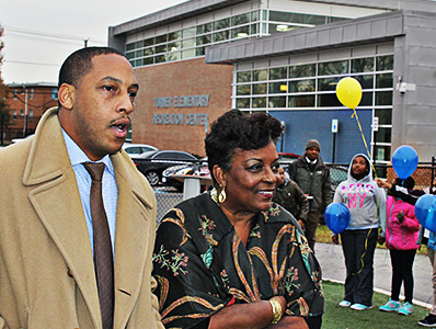 Eric Bethel, principal of Turner, joins Cora Barry, Mr. Barry’s widow, at the school tribute. 