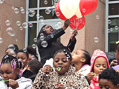 Students at Stanton stand outside their building and blew bubbles to honor Mr. Barry.