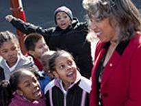 Photo of a DCPS principal with five elementary school students