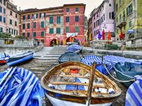 Photo of buildingd and boats in a foreign country