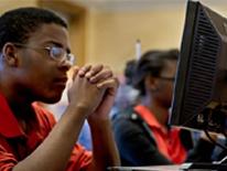 Photo of student at computer monitor